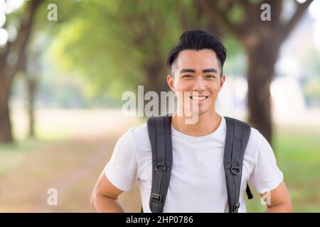 Smiling young man looking at camera Stock Photo