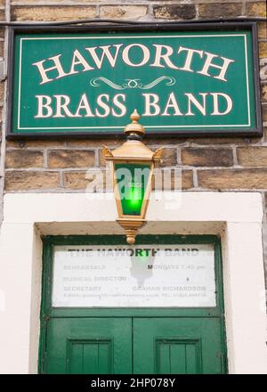 Haworth Brass Band sign above the door of The Fleece Inn in Howarth, Yorkshire, England, UK Stock Photo