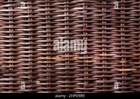 dark wicker wooden background. Weaving and hard work from natural resources components and environmentally friendly raw materials Stock Photo