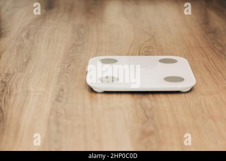 Modern Electronic Device. Measures Weight on Smart Scales. Stock Photo