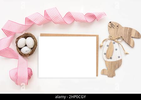 Easter mock up white greeting card and wood bunny Stock Photo
