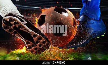 Soccer players in action with fiery soccerball during the match Stock Photo