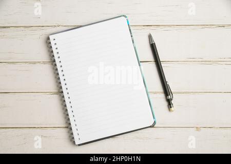 Keyboard Over A Table Beside A Notebook And Pens With Sticky Notes Stock Photo