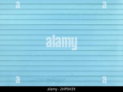 Background of pastel blue painted horizontal metal window roller shutter blinds, wood textured Stock Photo