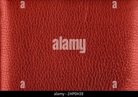 Close up background texture pattern of maroon red natural leather grain, directly above Stock Photo