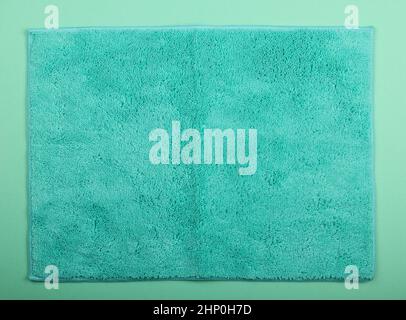 Close up teal blue microfiber washcloth, household cleaning wipe or towel background texture Stock Photo