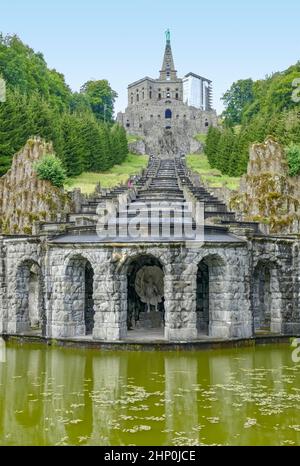 The Hercules monument with cascades and Plutogrotto at the Bergpark Wilhelmshoehe in Kassel, Germany Stock Photo