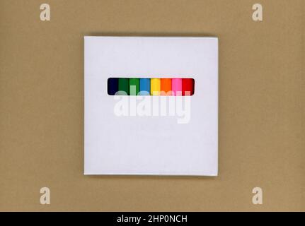 Colored pencils in a white cardboard box Stock Photo
