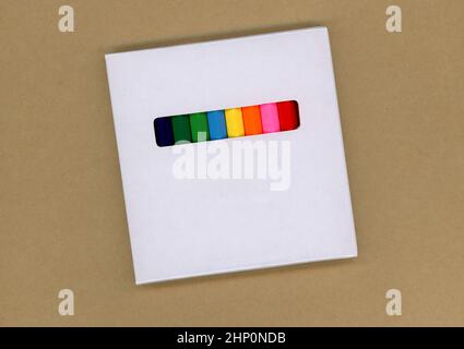Colored pencils in a white cardboard box Stock Photo