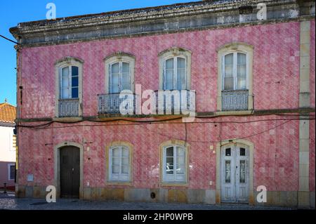 An old red-tiled house in a small Portuguese town. Stock Photo