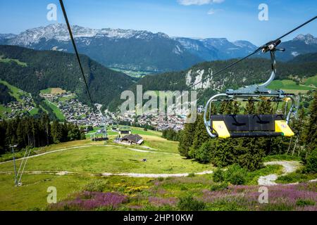 Chair lift above the village of La Clusaz in summer, France Stock Photo