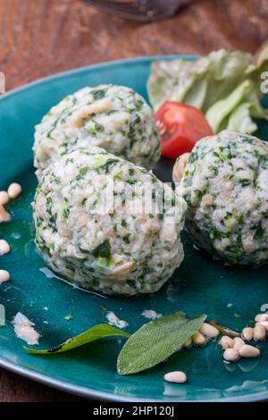 italian strangolapreti dumplings on green Stock Photo