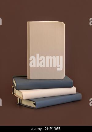 Stack of beige and grey hardcover notebooks isolated on brown closeup. Textbook mockup, planner cover with place fot text. Educational, business and o Stock Photo