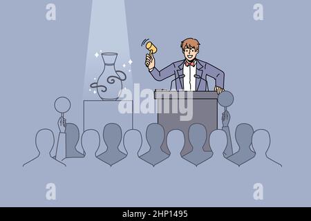 Male seller with gavel sell sculpture on auction to audience. Man auctioneer lead public buying event, people buyers raise hands make bids. Art galler Stock Photo
