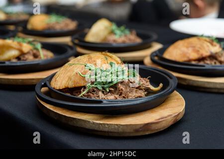 Plate of tasty Swiss dish with venison and cabbage served with herbs and flower petals Stock Photo