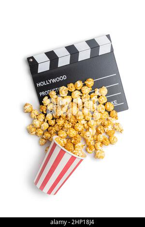 Sweet caramel popcorn and clapper board isolated on white background. Stock Photo