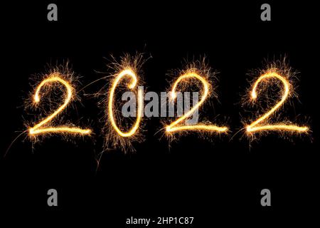 Happy new year. Digits 2022 made from fireworks isolated on black background. Stock Photo