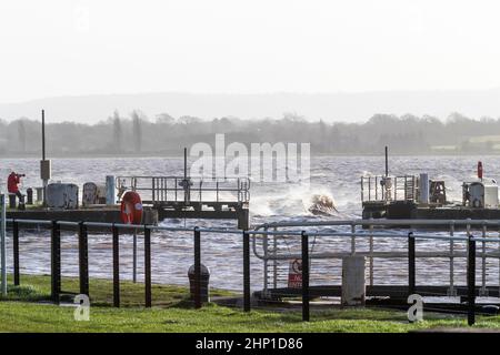 0900 Friday 18th February 2022. Storm Eunice: Lydney Harbour, Forest of Dean, River Severn, Gloucestershire. High tide and storm surge threaten to ove Stock Photo