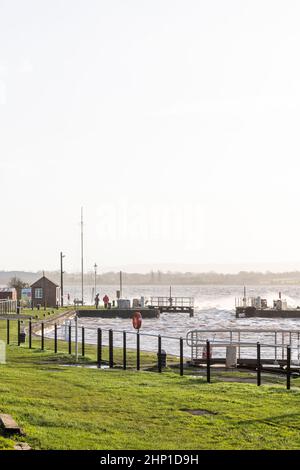 0900 Friday 18th February 2022. Storm Eunice: Lydney Harbour, Forest of Dean, River Severn, Gloucestershire. High tide and storm surge threaten to ove Stock Photo