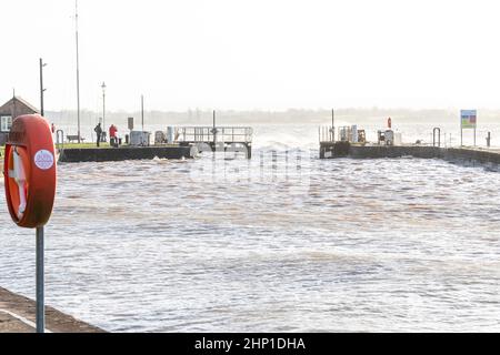 0900 Friday 18th February 2022. Storm Eunice: Lydney Harbour, Forest of Dean, River Severn, Gloucestershire. High tide and storm surge threaten to ove Stock Photo