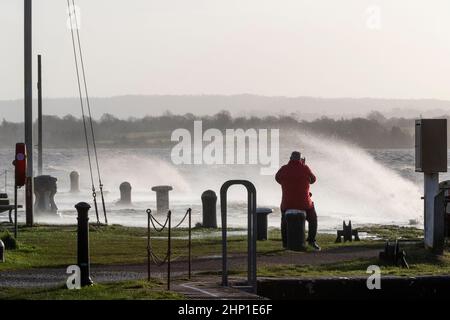 0900 Friday 18th February 2022. Storm Eunice: Lydney Harbour, Forest of Dean, River Severn, Gloucestershire. High tide and storm surge threaten to ove Stock Photo