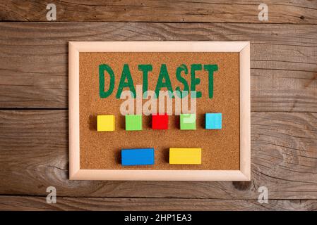 Sign displaying Dataset, Word for collection of numbers or values that relate to a particular subject Stack of Sample Cube Rectangular Boxes On Surfac Stock Photo