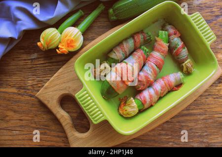 Grilled zucchini fries wrapped in a bacon . Stock Photo
