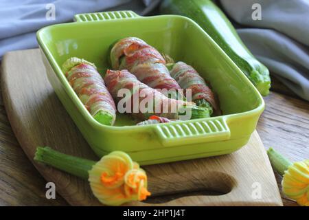 Grilled zucchini fries wrapped in a bacon . Stock Photo