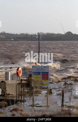 0900 Friday 18th February 2022. Storm Eunice: Lydney Harbour, Forest of Dean, River Severn, Gloucestershire. High tide and storm surge threaten to ove Stock Photo