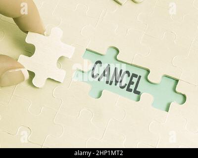 Handwriting text Cancel, Word Written on To decide or announce that planned event will not take place Building An Unfinished White Jigsaw Pattern Puzz Stock Photo