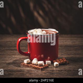 Hot chocolate with marsmallow candies and pieces of chocolate Stock Photo