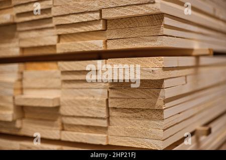 Lumber from the boards or wooden planed boards products in the warehouse or in the store for construction. Stock Photo