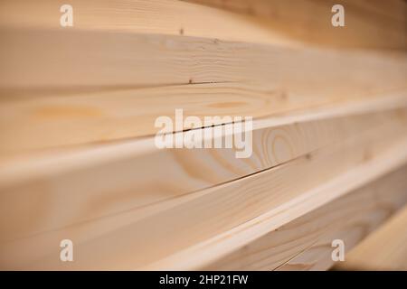 Lumber from the boards or wooden board products in the warehouse or in the store for construction. Selective focus Stock Photo