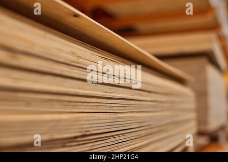 Lumber from the boards or wooden board products in the warehouse or in the store for construction. Selective focus Stock Photo