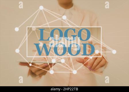 Handwriting text Logo Wood, Business idea Recognizable design or symbol of a company inscribed on wood Lady Holding Tablet Pressing On Virtual Button Stock Photo
