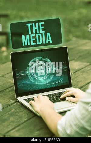 Text sign showing The Media, Conceptual photo main means of mass communication that are regarded collectively Laptop Placed Resting On Table Working I Stock Photo