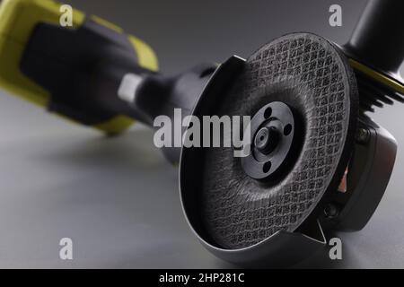 Equipment angle grinder on a gray background Stock Photo