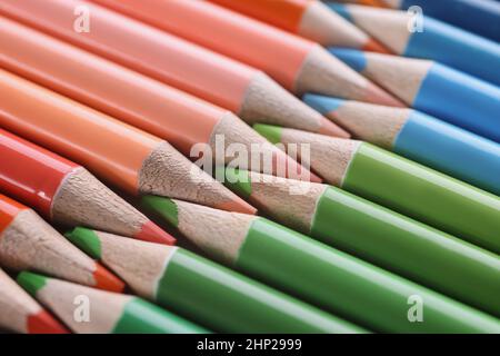 Macro sharpened red green blue pencils, blurry Stock Photo