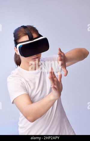 Young handsome man using virtual reality headset. VR gadgets Stock Photo