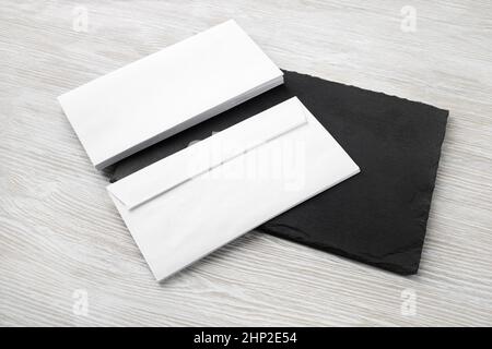 Two blank envelopes on stone board. Copy space. Responsive design template. Stock Photo