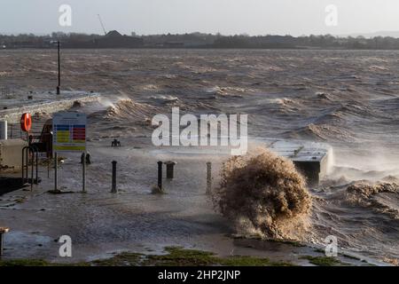 0900 Friday 18th February 2022. Storm Eunice: Lydney Harbour, Forest of Dean, River Severn, Gloucestershire. High tide and storm surge threaten to ove Stock Photo