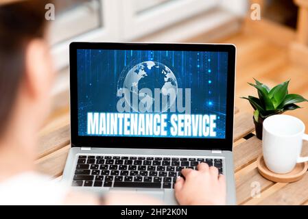 Handwriting text Maintenance Service, Concept meaning Keep a Product Service in Good Operating Condition Woman Typing On Laptop Beside Coffe Mug And P Stock Photo