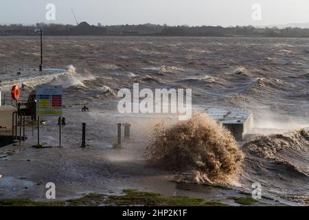 0900 Friday 18th February 2022. Storm Eunice: Lydney Harbour, Forest of Dean, River Severn, Gloucestershire. High tide and storm surge threaten to ove Stock Photo