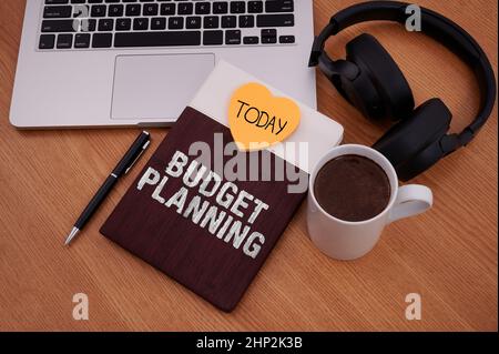 Inspiration showing sign Budget Planning, Internet Concept The written description about current and future expenses Blank Notepad Laptop With Pen And Stock Photo