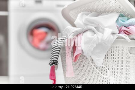 Laundry in the dirty clothes basket. Stock Photo