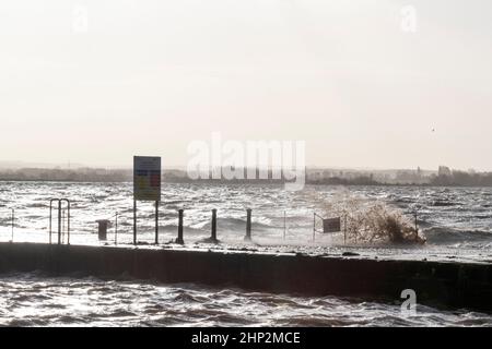 0900 Friday 18th February 2022. Storm Eunice: Lydney Harbour, Forest of Dean, River Severn, Gloucestershire. High tide and storm surge threaten to ove Stock Photo