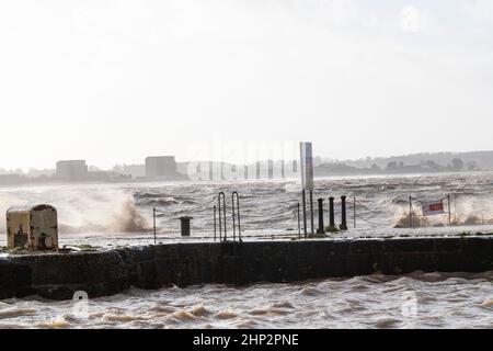 0900 Friday 18th February 2022. Storm Eunice: Lydney Harbour, Forest of Dean, River Severn, Gloucestershire. High tide and storm surge threaten to ove Stock Photo