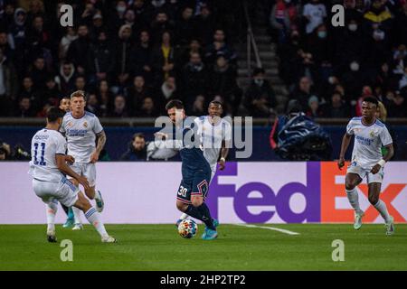 PARIS, FRANCE - FEBRUARY 15: Lionel Messi of Paris Saint-Germain and Marco Asensio and Toni Kroos of Real Madrid during the UEFA Champions League Roun Stock Photo