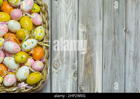 Easter egg basket colorful, hand painted. Easter background with space to write Stock Photo