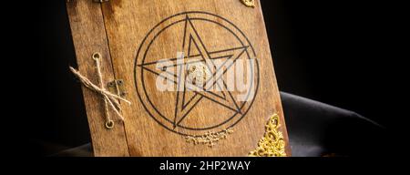 Old book of black magic. Concept for mystery, fantasy, dark evil Stock Photo